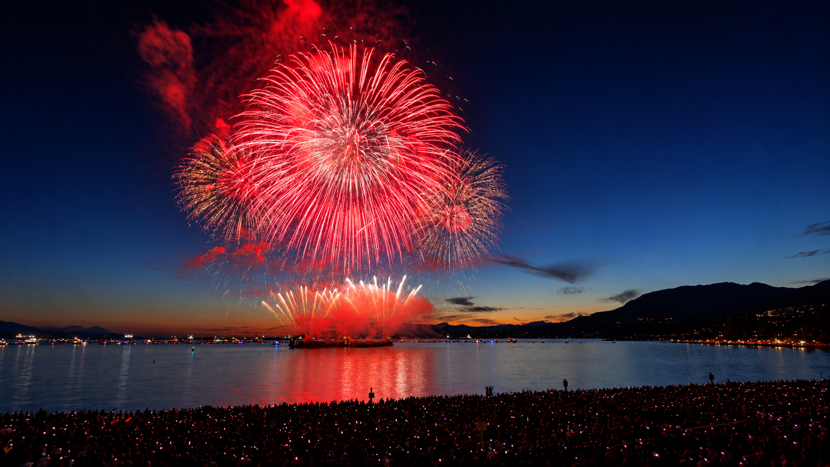 Red and gold fireworks over English Bay at the Celebration of Light